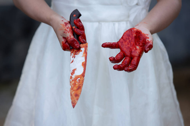 The hand that holds the knife, the blood of a female ghost, or a - Φωτογραφία, εικόνα