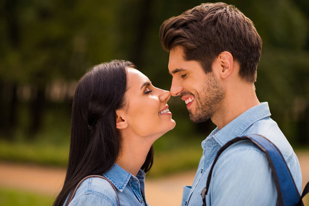 Profile photo of amazing pair going to kiss contacting noses closing eyes wear denim outfit - Φωτογραφία, εικόνα