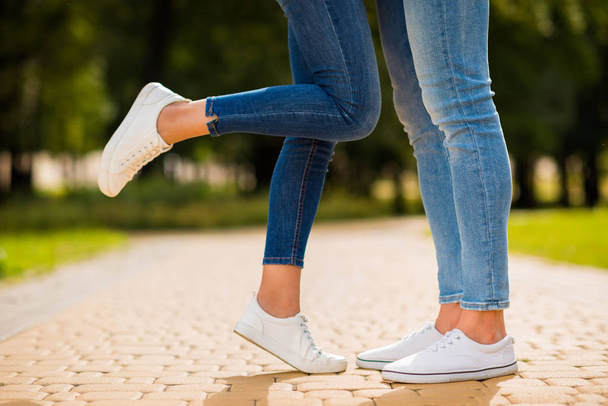 Cropped photo of charming pair legs stop in park for romance moment wear denim outfit - Photo, image