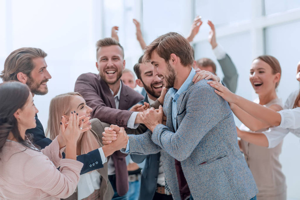 corporate group of employees applauding their colleague. - Fotografie, Obrázek