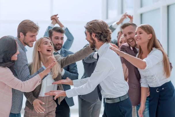 corporate group of employees congratulating each other on the victory - Fotó, kép