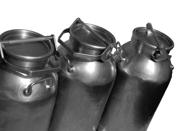 Three steel milk canisters isolated on white background - Foto, afbeelding