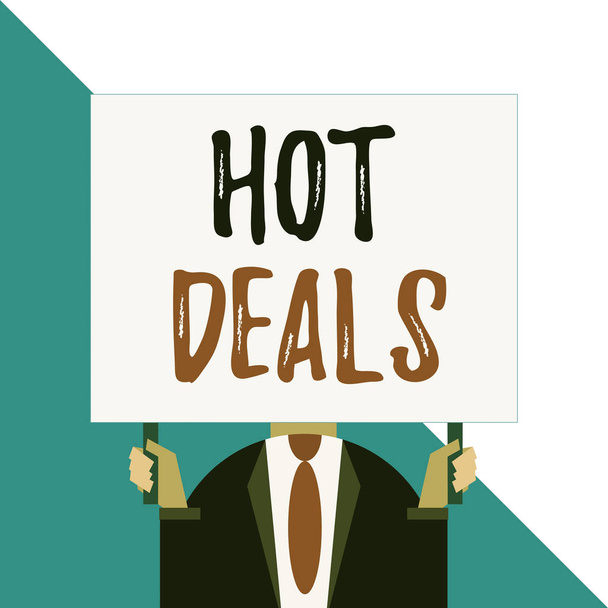 Conceptual hand writing showing Hot Deals. Business photo showcasing An agreement through which one of the paties is offered and accept Man chest dressed dark suit tie face holding big rectangle. - Foto, afbeelding