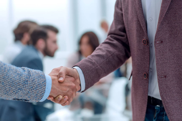 close up. handshake of business men on the office background - Φωτογραφία, εικόνα