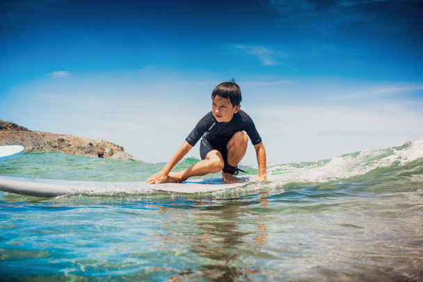 Boy prepared on ride on the sea wave, Greece - Photo, Image