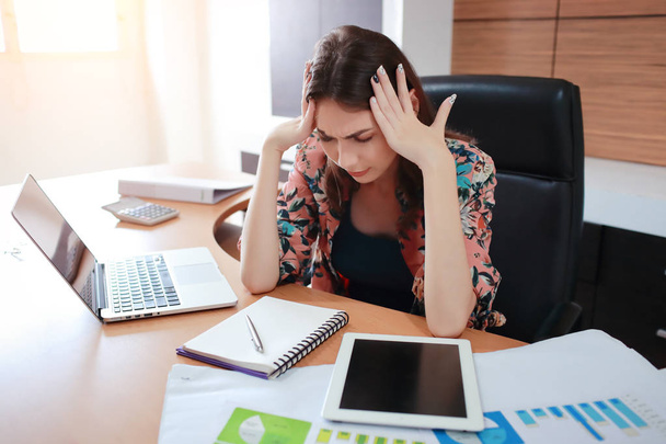 businesswoman using computer on table then got stress - Photo, image
