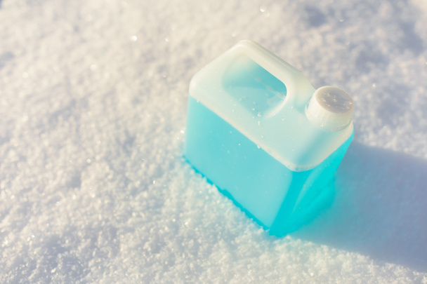 bottle with non-freezing windshield washer fluid, snow background - Photo, image