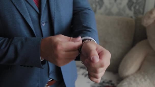 Businessman man straightens cuffs before going out. - Footage, Video