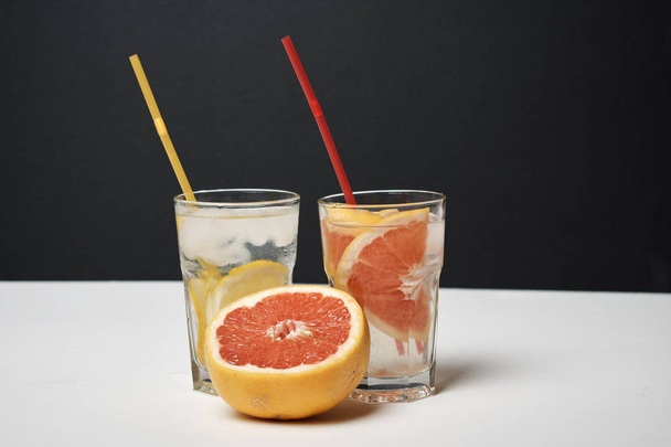 summer fresh cocktails with lemon and grapefruit slices, close view - Φωτογραφία, εικόνα