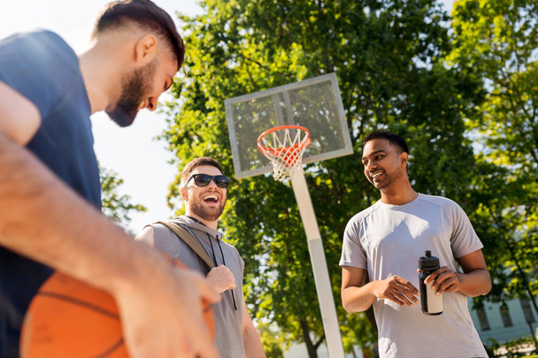 group of male friends going to play basketball - Photo, image