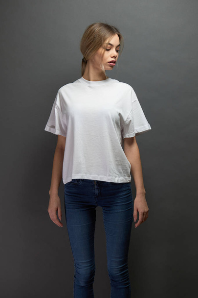 Sexy woman or girl wearing white blank t-shirt with space for your logo, mock up or design in casual urban style - Φωτογραφία, εικόνα
