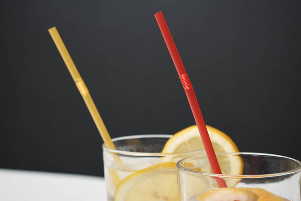 summer fresh cocktails with lemon and grapefruit slices, close view - Fotó, kép