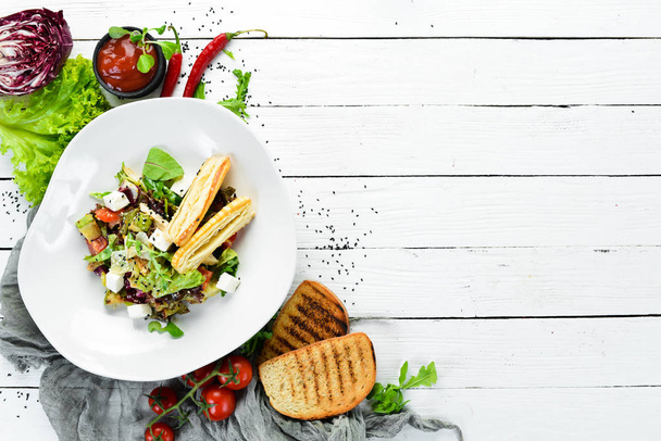 Vegetable salad with feta cheese. Food. Top view. Free space for your text. - Foto, Bild