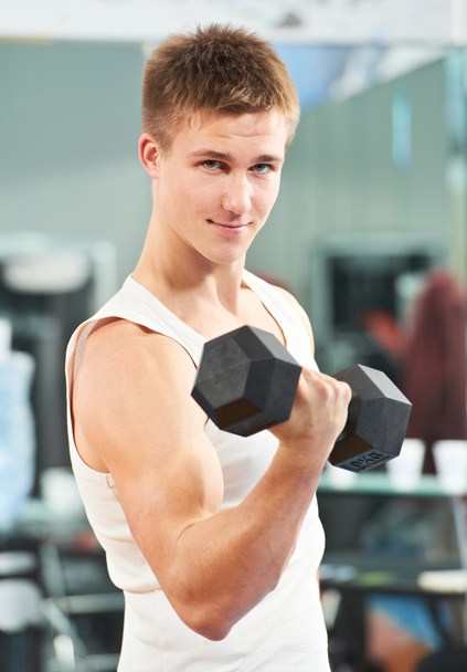Bodybuilder man doing biceps muscle exercises - Foto, Bild