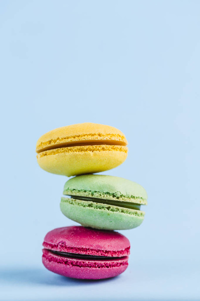 Colorful macaroons on a blue background, close-up, Flatley with  - Φωτογραφία, εικόνα