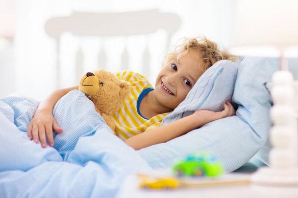 Child playing in bed. Kids room. Baby boy at home. - Foto, Imagen