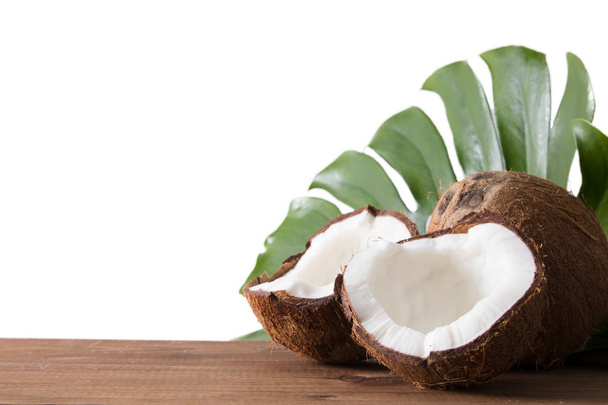 isolated open natural coconut insulated in white on wood - Foto, immagini