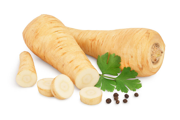 Parsnip root and slices with parsley peppercorns isolated on white background closeup - Photo, Image