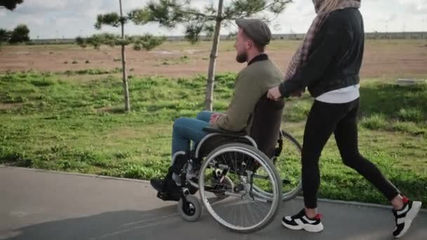 Disabled man on walk with girlfriend - Footage, Video