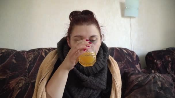 sick girl drinks water with a dissolved cold pill - Πλάνα, βίντεο