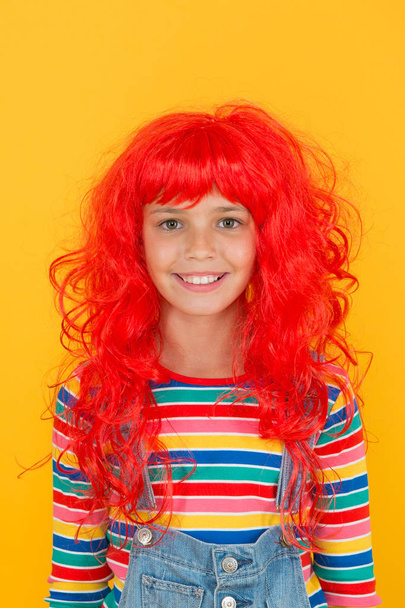Crazy redhead wig. Messy hairstyle. Kid cheerful smiling happy redhead girl. I am ginger and proud of it. Redhead stereotypes. Redheads are not some creatures with magical soul sucking powers - Valokuva, kuva
