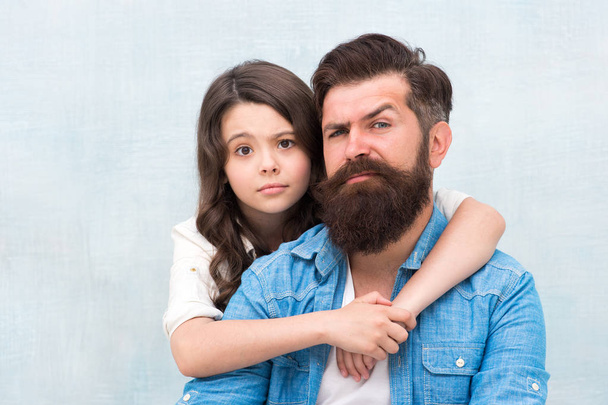 Lovely father and cute kid. Father and daughter hug light background. Family hug. Strengthening father daughter relationships. Child and dad best friends. Friendly relations. Fathers day concept - Photo, image