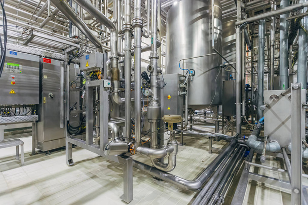 Modern brewery interior. Filtration vats, pipeline, valves and o - Photo, Image
