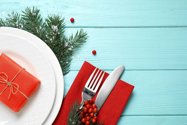 Christmas table setting on blue wooden background, top view. Space for text - Fotó, kép