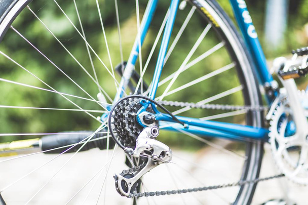 Closeup shot of blue bicycle gears with a blurred background - Photo, image