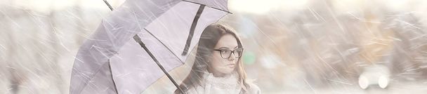 long background girl umbrella / horizontal view rainy autumn day young woman with umbrella - Fotografie, Obrázek
