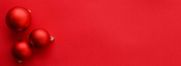 Christmas baubles on red flatlay backdrop, luxury winter holiday - Zdjęcie, obraz
