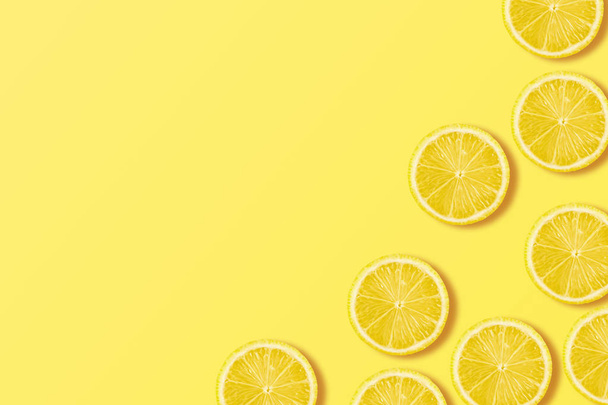 A slices of fresh juicy yellow lemons. Texture background - Фото, изображение