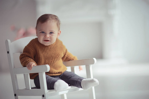 kid in a warm sweater child boy / portrait seasonal clothes, warm knitted sweater on a child, autumn portrait - Foto, Imagen