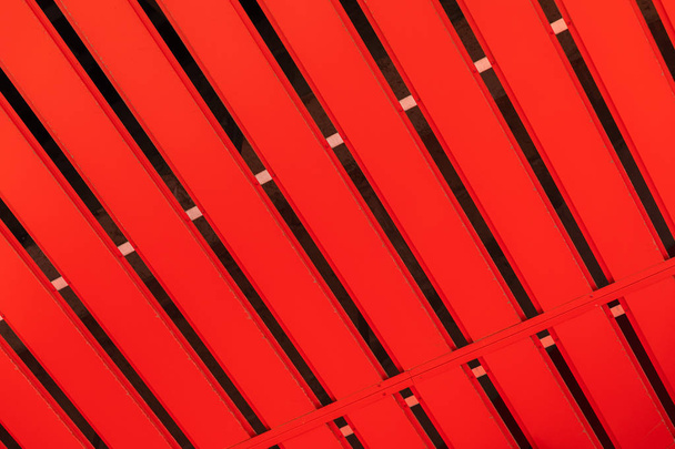Corrugated orange metal profile surface (corrugated metal siding, profiled sheeting) background - Фото, изображение