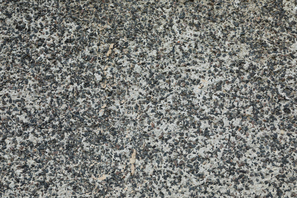 Niegładka nawierzchnia betonu zmieszana ze żwirem - Zdjęcie, obraz