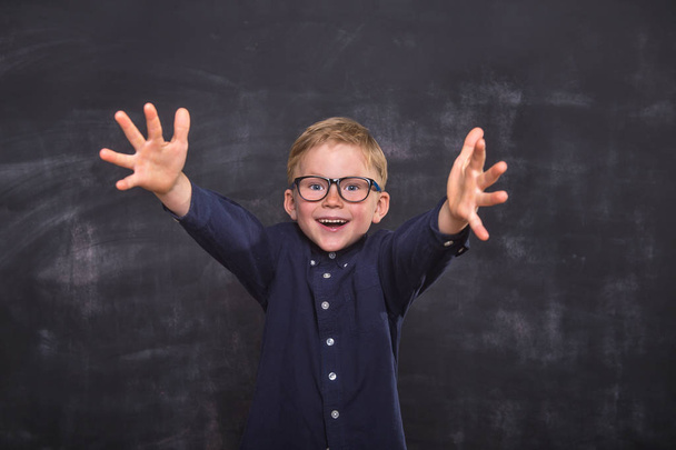 Child boy happy smiling kid go back to school, kindergarten. Success, motivation, winner, genius concept - Fotó, kép