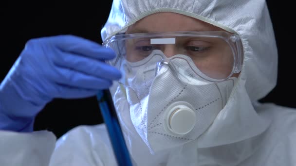 Scientist showing biohazardous liquid to camera, deathly weapons development - Πλάνα, βίντεο