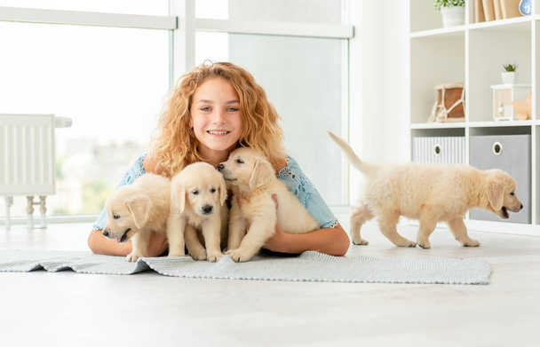 Girl resting with puppies - Фото, изображение