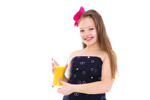 Young girl with glass of orange juice. - Fotó, kép