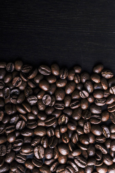 Coffee beans on wooden background. - Zdjęcie, obraz