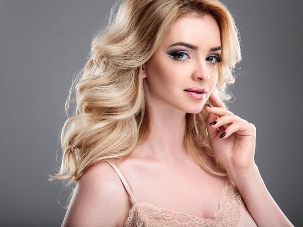 Beauty portrait of blonde beautiful woman with perfect makeup and hair style, isolated. Spa and hair, healthy skin - Fotó, kép