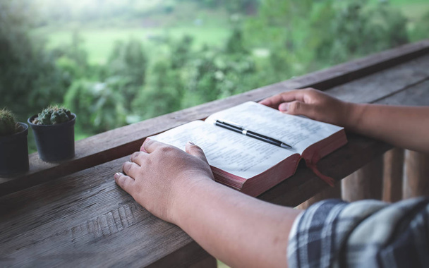 close up hand reading a holy bible. christian concept. - Valokuva, kuva