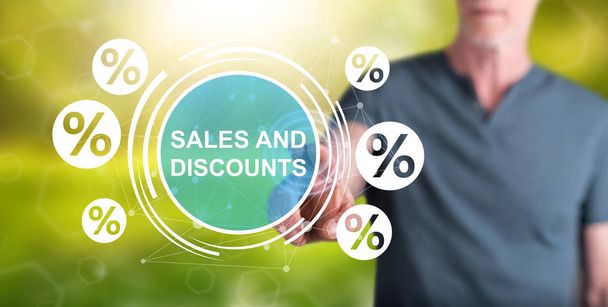 Man touching a sales and discounts concept - Photo, Image