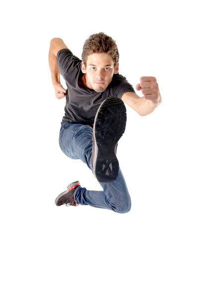 teenage boy jumping isolated in white - Photo, Image