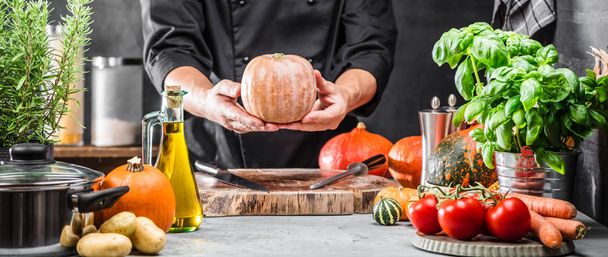 cropped shot of male chef preparing fresh vegetables and ingredients on table - Фото, изображение