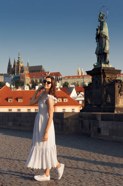 A girl walks around Prague on a sunny day. - Fotoğraf, Görsel