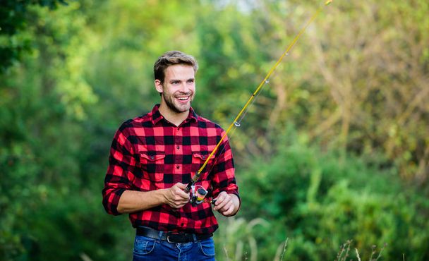Fishing is fun. fly fishing. man checkered shirt on ranch. fisher hobby. fisherman with fishing rod. happy man western portrait. Vintage style man. Wild West retro cowboy - Zdjęcie, obraz