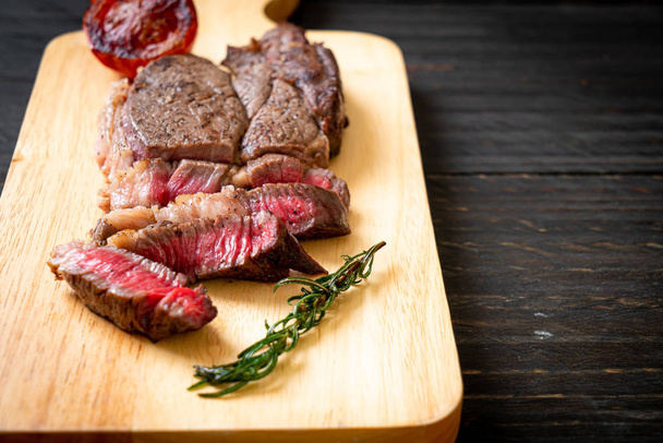 Grilled medium rare beef steak - Фото, зображення