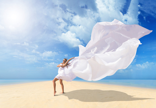Beautiful Girl With White fabric on The Beach. - Photo, Image