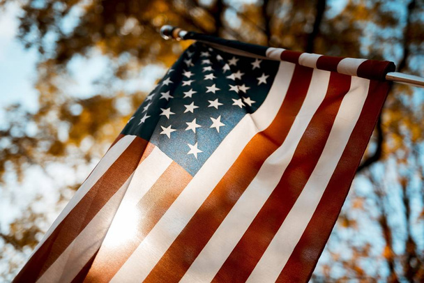 Flag of the united states shot from a low angle with a blurred background - Fotó, kép